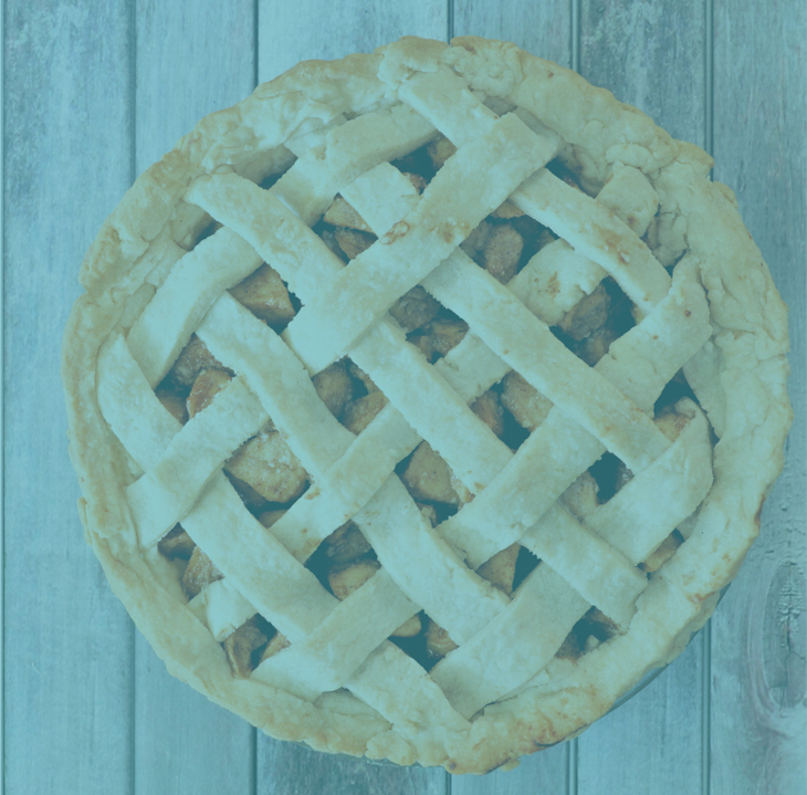 Homemade fruit pie with lattice crust on blue wooden surface