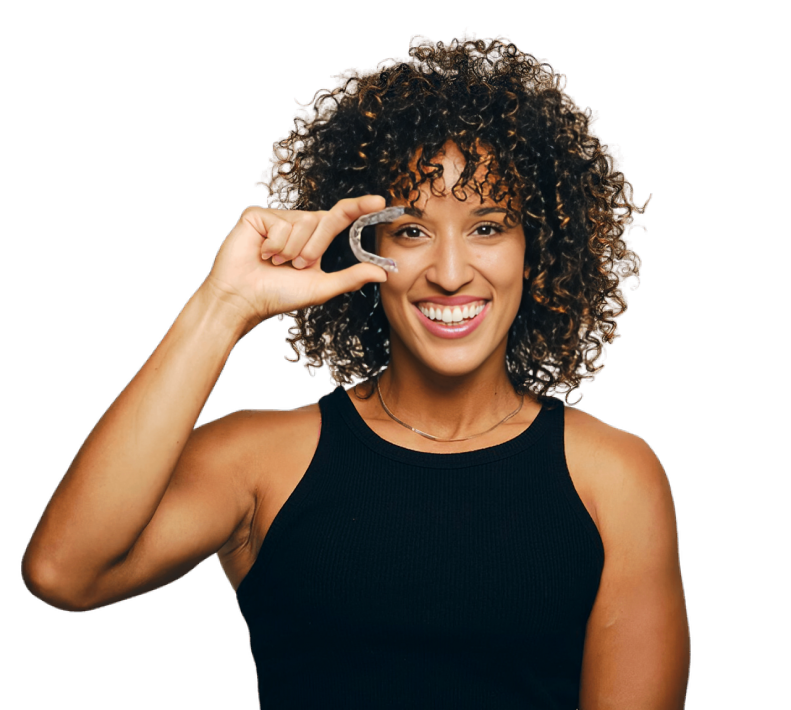 Woman in black tank top making phone call gesture against white background, smiling